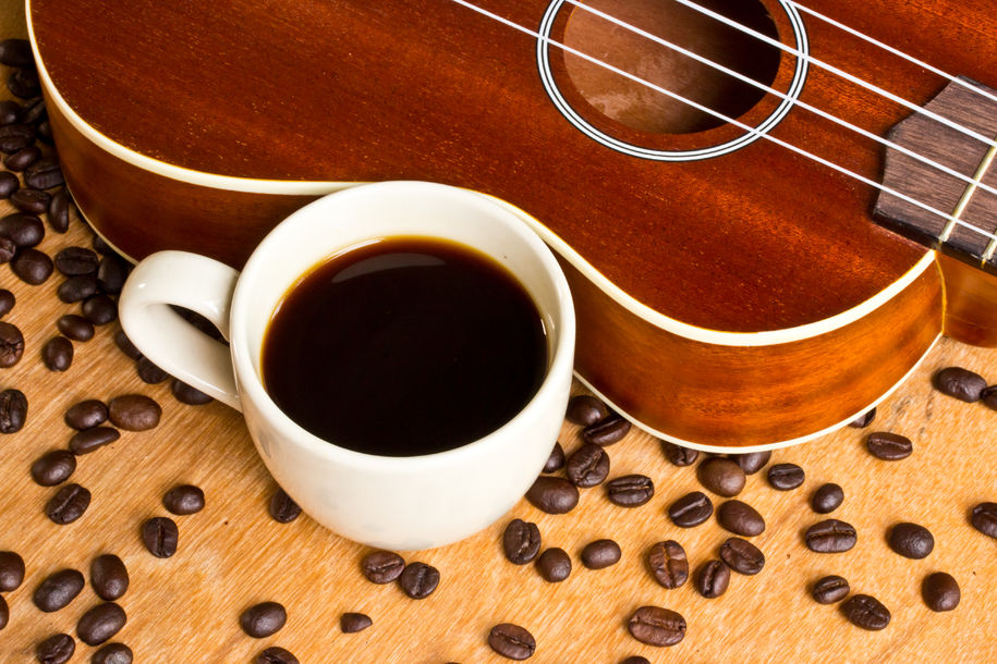 Coffee and Ukulele on wood background Coffee and Ukulele on wood background