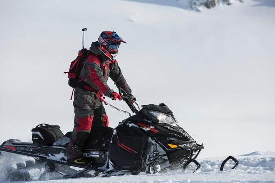 person-riding-on-snowmobile-804568