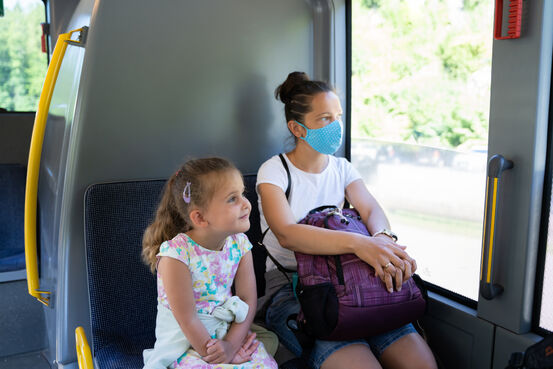 41214049-woman-on-bus-wearing-face-mask (1)