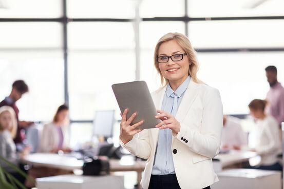18980500-businesswoman-with-tablet-pc-computer-at-office (1)