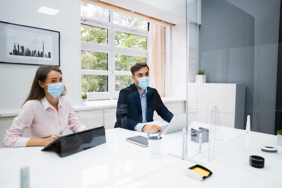 42005764-face-mask-office-social-distancing-meeting