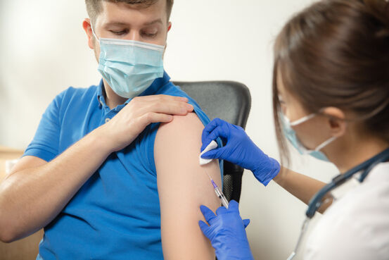 44942182-close-up-doctor-or-nurse-giving-vaccine-to-patient-using