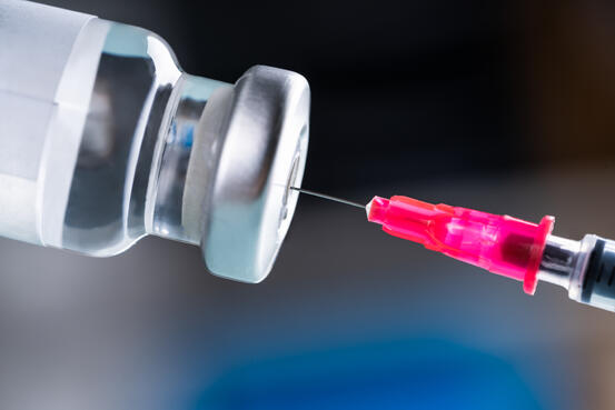 36101928-filling-shingles-vaccine-syringe
