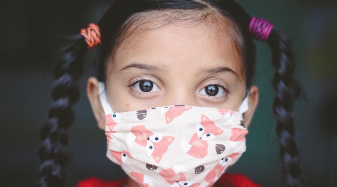 Young girl waring a face mask