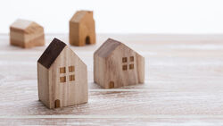 House model on wooden background