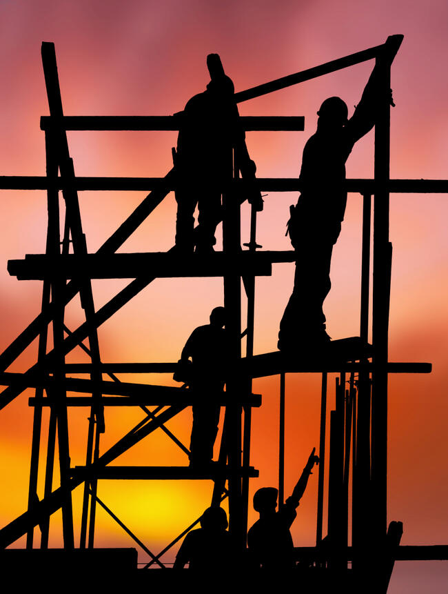 1762207-construction-workers-against-colorful-sunset