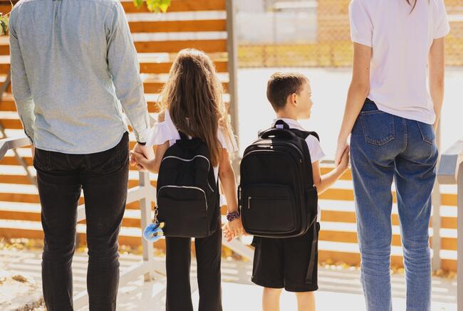57123148-the-first-day-at-school-parents-and-children-walk-hand