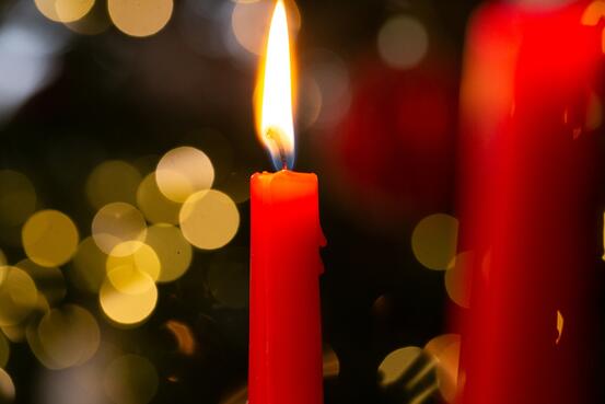 63458976-christmas-candles-burning-candles-on-bokeh